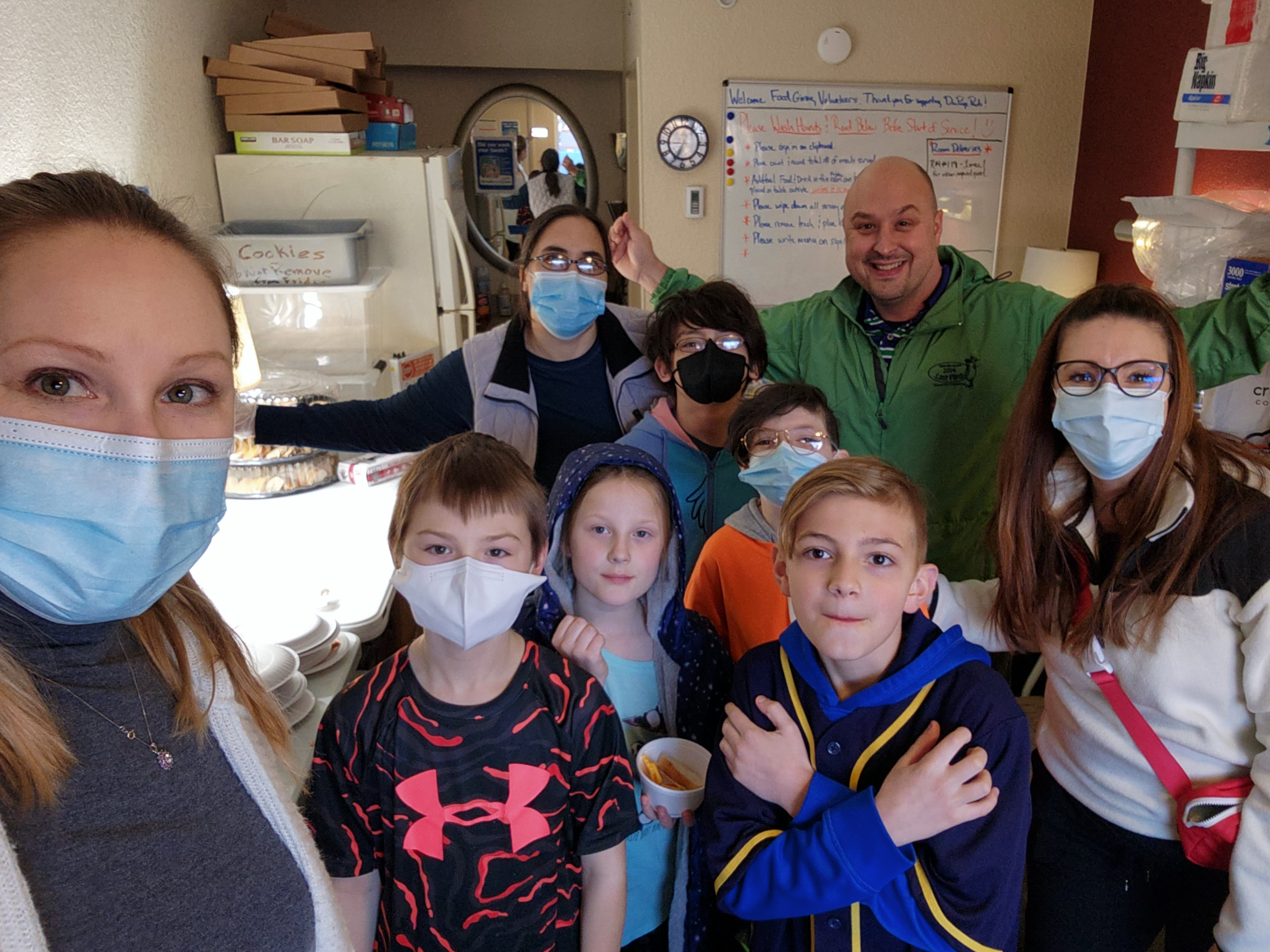 James Bernicky, Jodi Bernicky, Kat Stapleton, Beth DeGeeter and the Kid Crew serve dinner at the DuPage Pads interim housing facility.